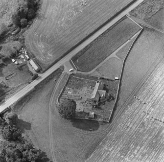 Oblique aerial view of Edderton Parish Church and churchyard.