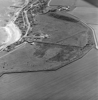 Oblique aerial view showing village of Hilton of Cadboll and site of 'Our Lady's Chapel'.
