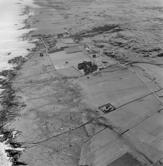 Oblique aerial view of Iona Abbey and Baile Mor villlage from N.