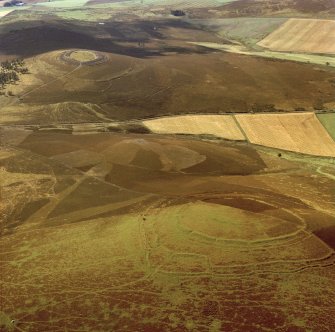 Oblique aerial view centred on the remains of the forts at Brown Caterthun and White Caterthun.