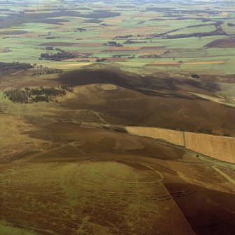 Oblique aerial view centred on the remains of the forts at Brown Caterthun and White Caterthun.
