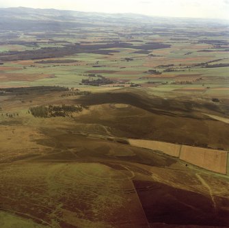 Oblique aerial view centred on the remains of the forts at Brown Caterthun and White Caterthun.