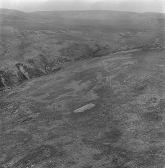 Oblique aerial view centred on the chambered cairn at Carn Ban, Arran.
