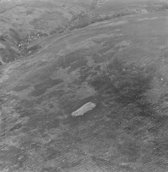 Oblique aerial view centred on the chambered cairn at Carn Ban, Arran.