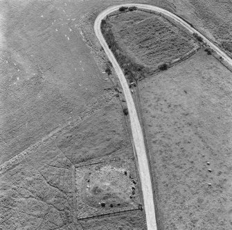 Oblique aerial view centred on Auchagallon cairn and stone circle, Arran.