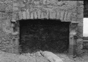 Interior view of Harthill Castle showing detail of fireplace in hall.