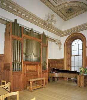 Interior. Detail of Chapel pipe organ and piano.