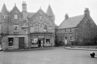 General view of Savings Bank, M &D Co-Operative shop and Fountain House, High Street, Falkland, from south east.