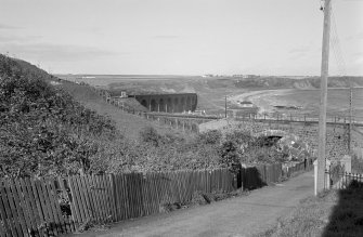 General view of Cullen Burn railway viaduct and North Deskford Street Railway arch, Cullen from SE.