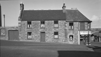 View of Fred Woollam's grocery and provions shop, The Square, Cullen from SE.