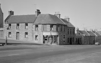 View of Fred Woollam's grocery and provions shop, The Square, Cullen from E.