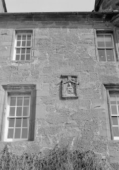 Detail of Gardyne Castle showing heraldic panel and windows from S.