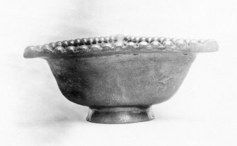 Traprain treasure - "a triangular dish".From a photograph album of the Curle family, 1911-19.