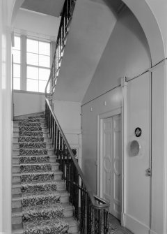 Interior view of Cairness House showing staircase to right of front.