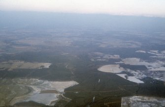 General oblique aerial view over Assich forest