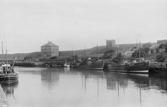 General view of Gunsgreen House and dovecot and Eyemouth harbour.