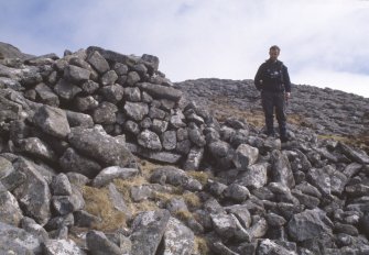 Eigg, An Sgurr, Fort. View of section of wall with Alex Hale.