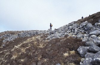 Eigg, An Sgurr, Fort. View of fort wall from E with Alex Hale in background.