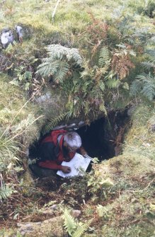Eigg, Struidh, Ritual Enclosure. Ian Parker undertaking a plane table survey of 'The Oracle' chamber.