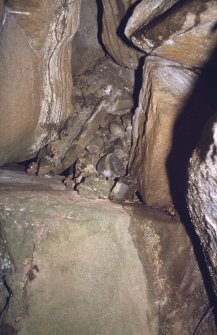 Eigg, Struidh, Ritual Enclosure. View of midden material on chamber floor.