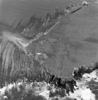 Oblique aerial view of the chapel and settlement at Brough of Birsay.