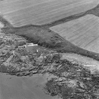 Oblique aerial view centred on the remains of Broch of Burgar.