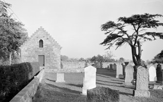 General view of the tithe barn and churchyard, Foulden.