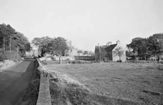 Distant view of the tithe bar, church and manse, Foulden.