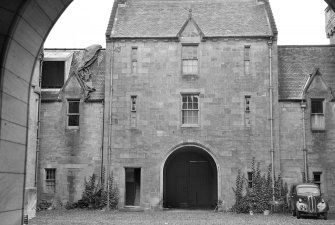View of north west range of Duntreath Castle and entrance to garden from courtyard  from SE, showing part of the building to be demolished.