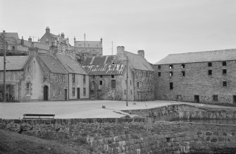 General view of buildings in Shorehead harbour, Portsoy, including Corf Warehouse.