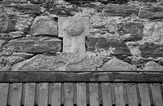 Detail of carved stone in wall at 10 Shorehead, Portsoy