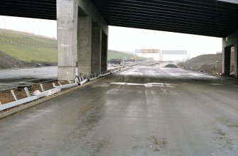 M8, Monklands Motorway
Frame 21: General view looking ESE through the arch of Easterhouse Road motorway bridge to J8. Card 45.
