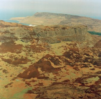 Oblique aerial view centred on the remains of the An Sgurr fort, taken from the SSW.