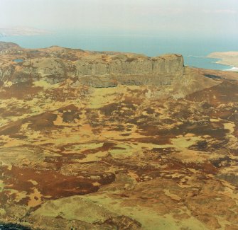 Oblique aerial view centred on the remains of the An Sgurr fort, taken from the S.