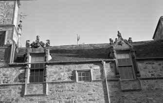 Detail of carved pediments, N elevation of courtyard, Cullen House.