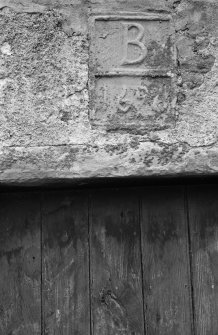Detail of panel inscribed 'B 1696' above entrance, Ballindalloch Castle dovecot.