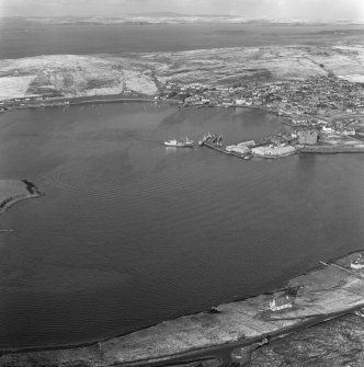 Oblique aerial view of Scalloway town and castle.