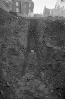 Excavation photograph : trench H - hill wash, slope of ground, looking west.
