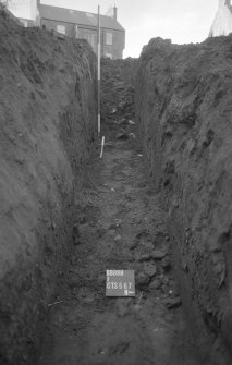 Excavation photograph : trench H - hill wash, slope of ground, natural, looking west.