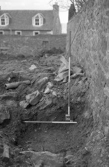 Excavation photograph : trench J, soil and natural, looking east.