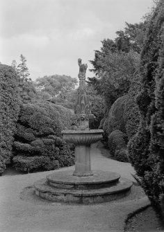 View of fountain and surrounding shrubbery in garden of Ravelston House, Edinburgh.