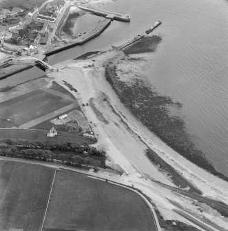 Oblique aerial view of bridge under construction and the site of Helmsdale Castle.