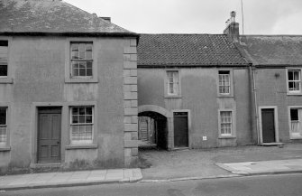 View of Mews Cottage and Croftview House, High Street, Ayton, from NE.