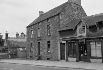 View of 1 and 2 High Street, Ayton, from N, showing Moffat House and the premises of Dickson Hume Confectioner.