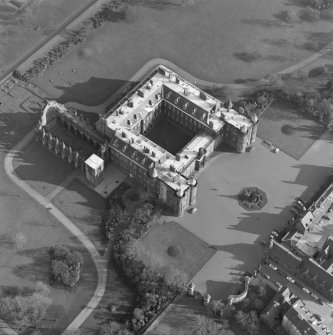 Oblique aerial view of Holyrood Palace and Abbey, Edinburgh, with fountain also visible.
