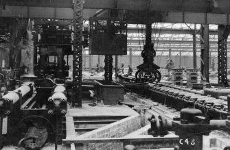 Interior.
View of Pilger Mill, Mandrel Threader, Hollow Bloom Conveyor and Feed Carriage.