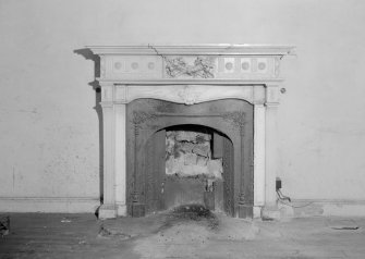 Interior view of Fordell House showing detail of wooden chimney piece in room at ground floor back.