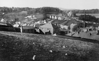 Modern copy of historic photograph showing general view from SE with old Parish Church in the distance.
