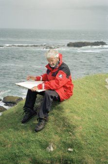 Muck, Caisteal an Duin Bhain. Fort. Site survey in progess. Ian Parker with the drawing board.