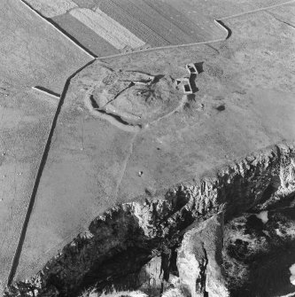 Oblique aerial view centred on the remains of the broch at Dalsetter.
